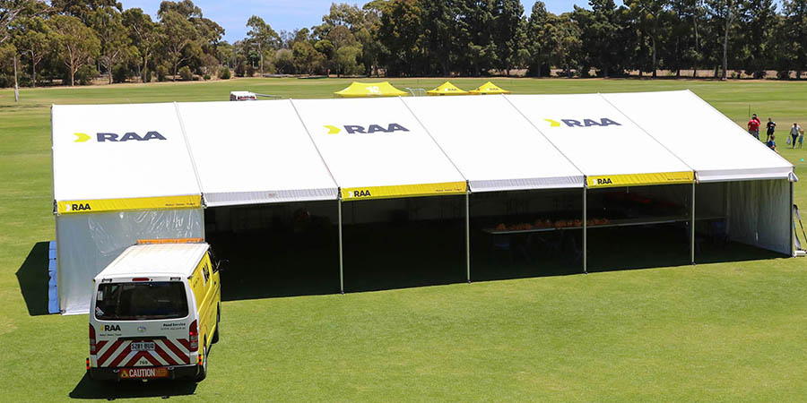 RAA community marquee with RAA van parked outside it