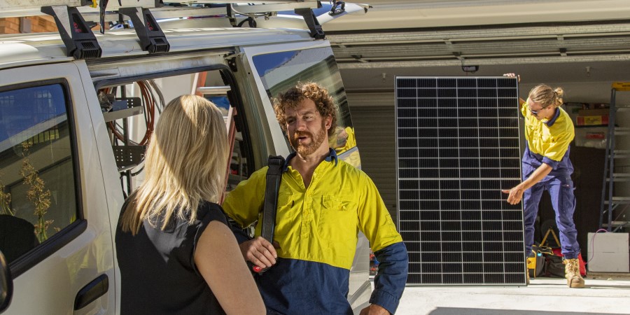 Solar experts installing panels