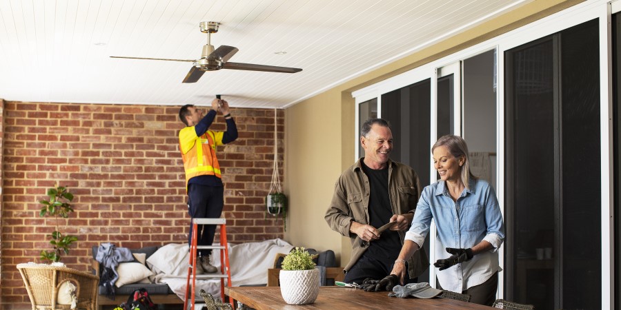 Electrician fixing downlight