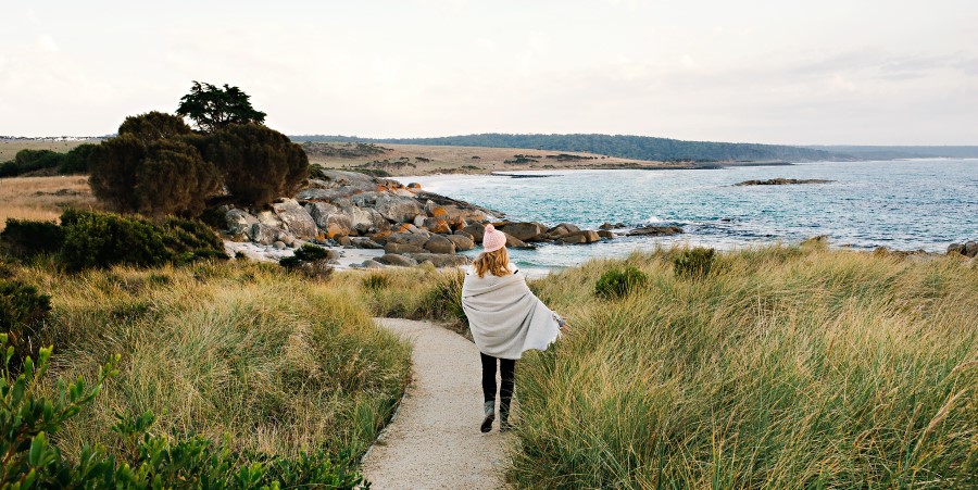 Woman walking towards the beach